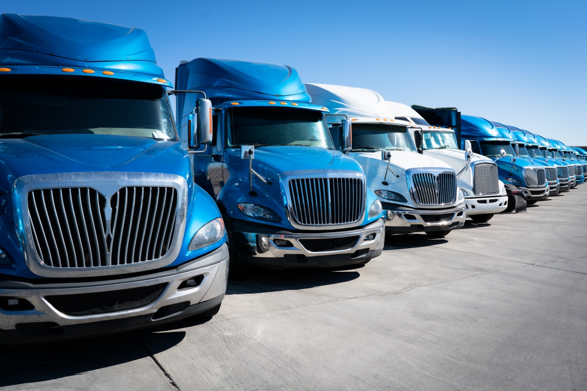 dreamstime-xxl-110529364-61ae70bc1e739 Image of a fleet of trucks