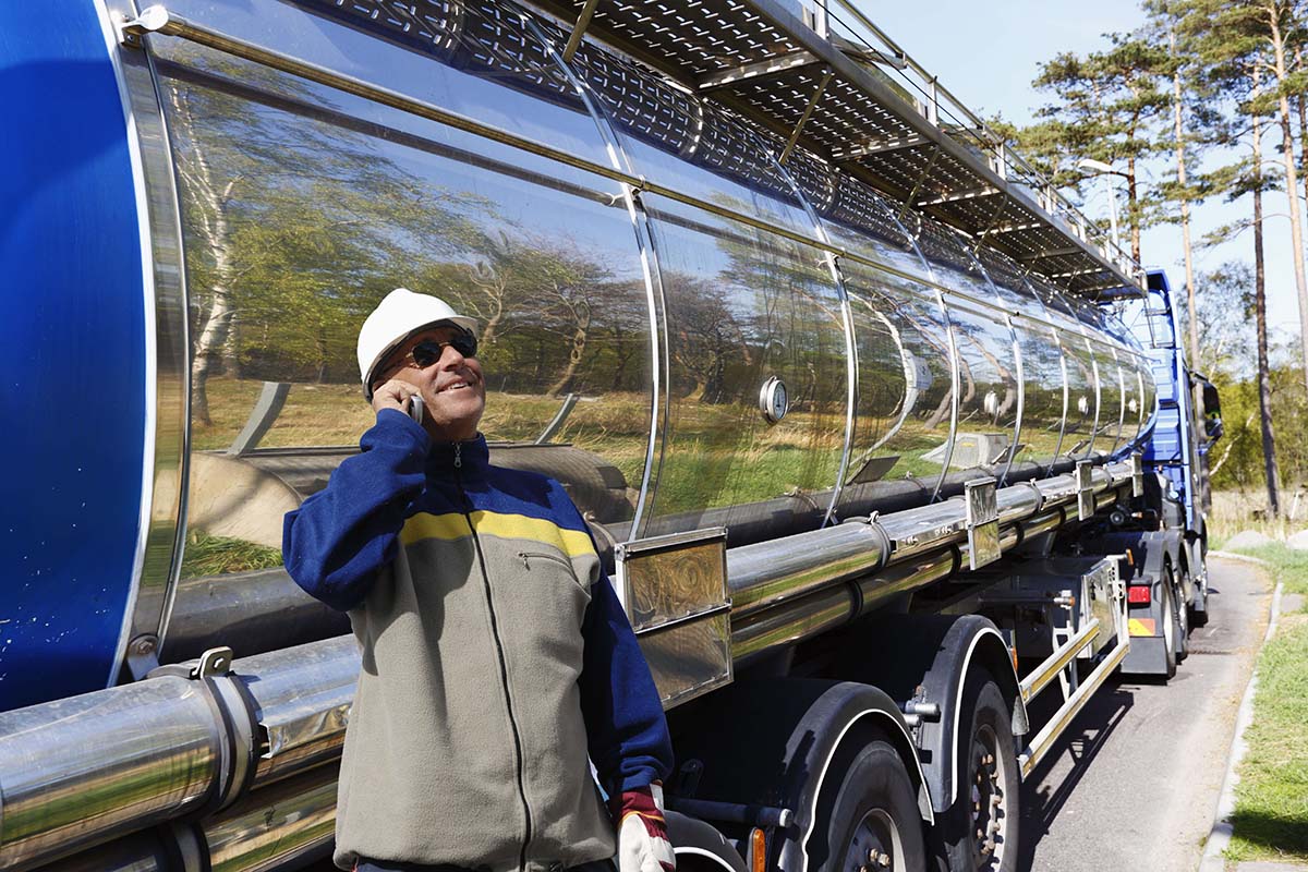 dreamstime-xxl-40361862-1-61af832a1b86a Image of a truck driver on the phone