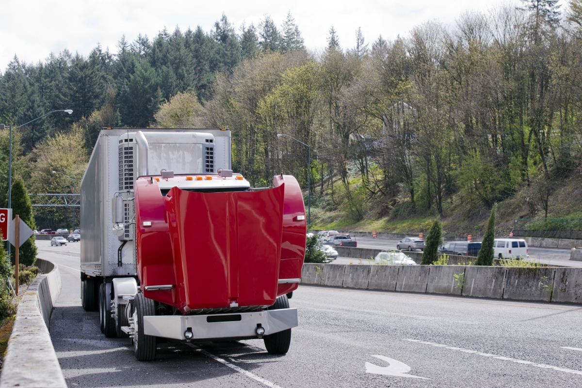 dreamstime-xxl-93075780-61ae630597bf6 Image of a semi-truck getting repaired