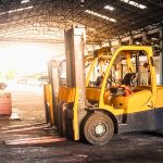 Industries We Serve-5 forklifts in manufacturing warehouse
