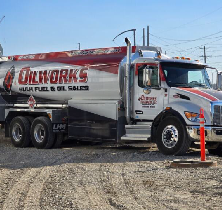 Bulk fuel delivery truck parked at a commercial job site ready for fuel delivery.