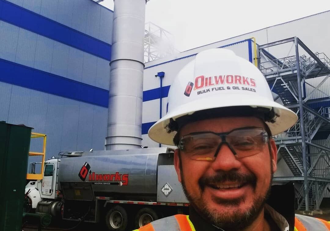 What Safety Measures Are in Place During Fuel Delivery 1 happy oilworks worker