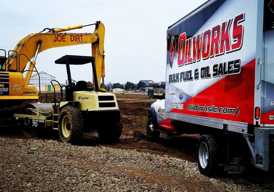 What Safety Measures Are in Place During Fuel Delivery 2 oilworks truck with construction machinery in background